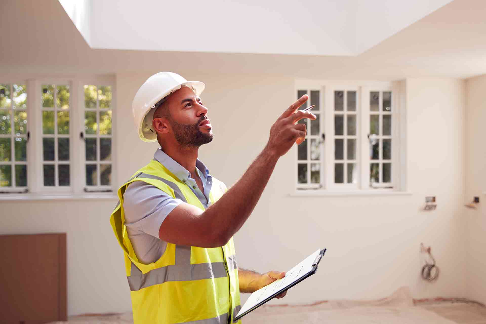 Third Party Wall Surveyors Southampton reviewing plans between two parties during a dispute